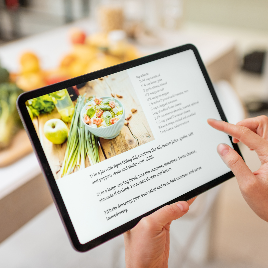 A visual representation of saving recipes from various sources like cookbooks and websites into a central digital library.